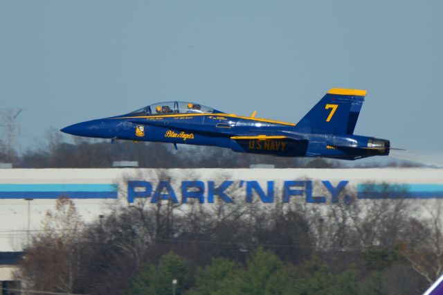 McDonnell Douglas FA-18 Hornet — - PARK'NFLY - I wish there was a service at Nashville where you could park your car and fly on an F18.br /br /No.7 of the Blue Angels departing Nashville off or runway 31. Lt. Julius Bratton and Lcdr Adam Kerrick indicated on the aircraft.