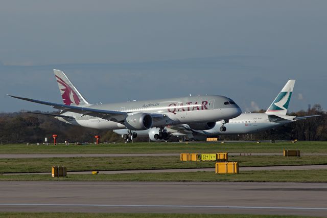 Boeing 787-8 (A7-BCV) - Two big Boeings.  QTR45 just about to touch down with B-KPY as CX358 in the background in the queue to depart to Hong Kong