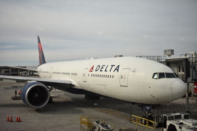 Boeing 777-200 (N701DN) - Before departure from Detroit to Shanghai. Sorry for those little black dots on the DTW windows