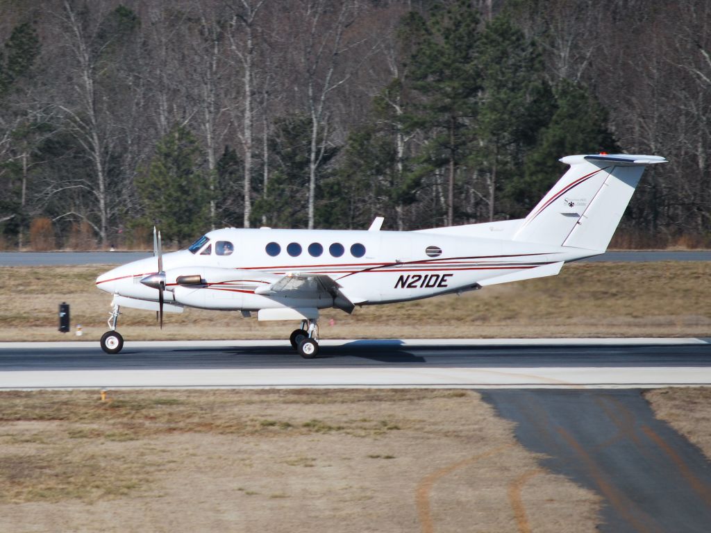 Beechcraft Super King Air 200 (N21DE) - Landing on runway 20 at Concord Regional Airport (Concord, NC) - 2/6/09