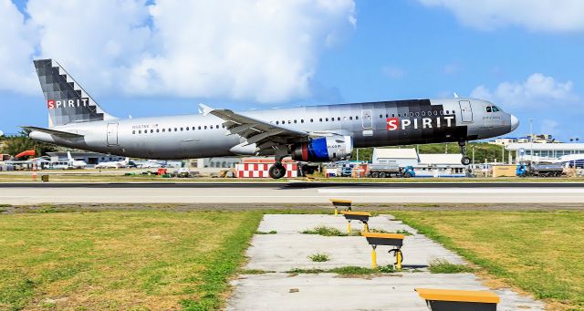 Airbus A321 (N587NK) - Spirit Airlines N587NK landing at TNCM Princess Juliana International Airport - St. Maarten with there A321 spirit of Jamaica. They could a at least painted the engine covers red yellow black and green!!!