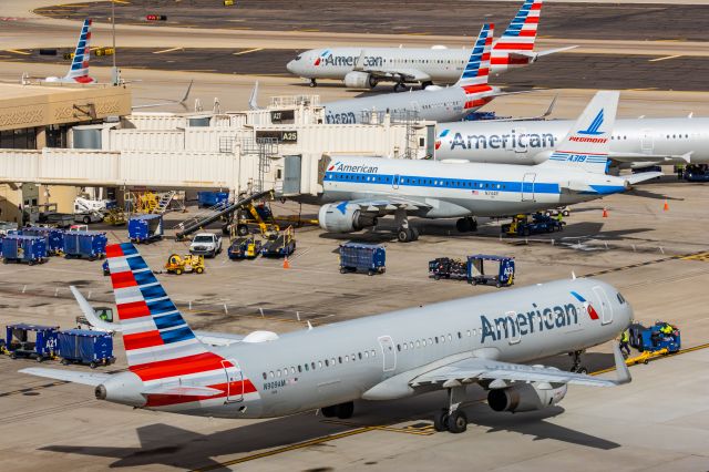 Airbus A319 (N744P) - An American Airlines A319 in Piedmont retro livery parked at PHX on 2/13/23, the busiest day in PHX history, during the Super Bowl rush. Taken with a Canon R7 and Canon EF 100-400 II L lens.