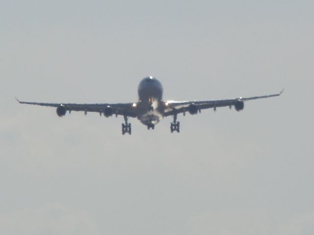 Airbus A340-300 (EC-GHX) - The silhouette of an Iberia Airlines A340-300.On final approach