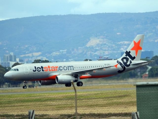 Airbus A320 (VH-VGJ) - On taxi-way heading for Terminal 1 after landing on runway 23. Tuesday 27th December 2011.