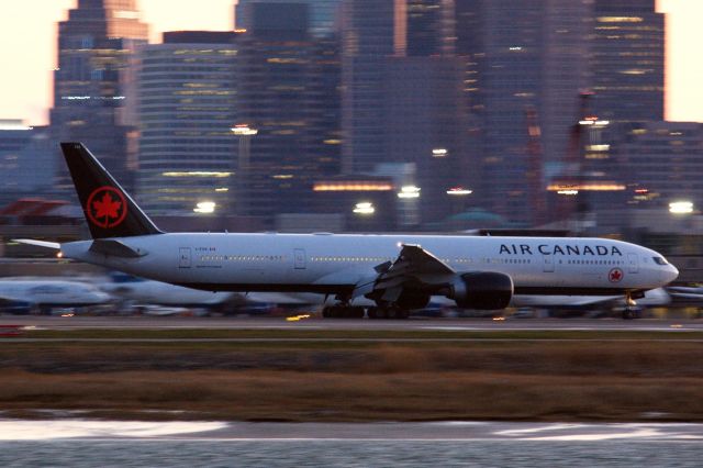 BOEING 777-300ER (C-FIVX) - This Air Canada B777-300, which are rare for BOS, lands as the sun sets behind the Boston buildings, bring supplies to help fight COVID 19. 