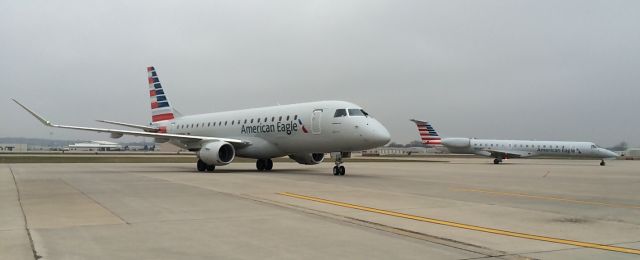 — — - E175 arriving from ORD, E145 departing for DFW.