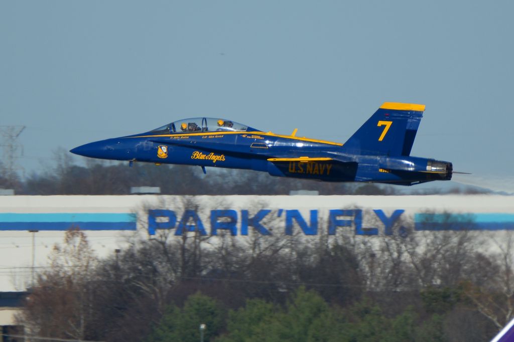 McDonnell Douglas FA-18 Hornet — - PARK'NFLY - I wish there was a service at Nashville where you could park your car and fly on an F18.br /br /No.7 of the Blue Angels departing Nashville off or runway 31. Lt. Julius Bratton and Lcdr Adam Kerrick indicated on the aircraft.