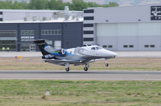 Embraer Phenom 100 (N575JT) - A very stunning Phenom jet arriving from California just before touching down in front of Duncan Aviation. I love the colors in this livery!br /Best viewed in full! 