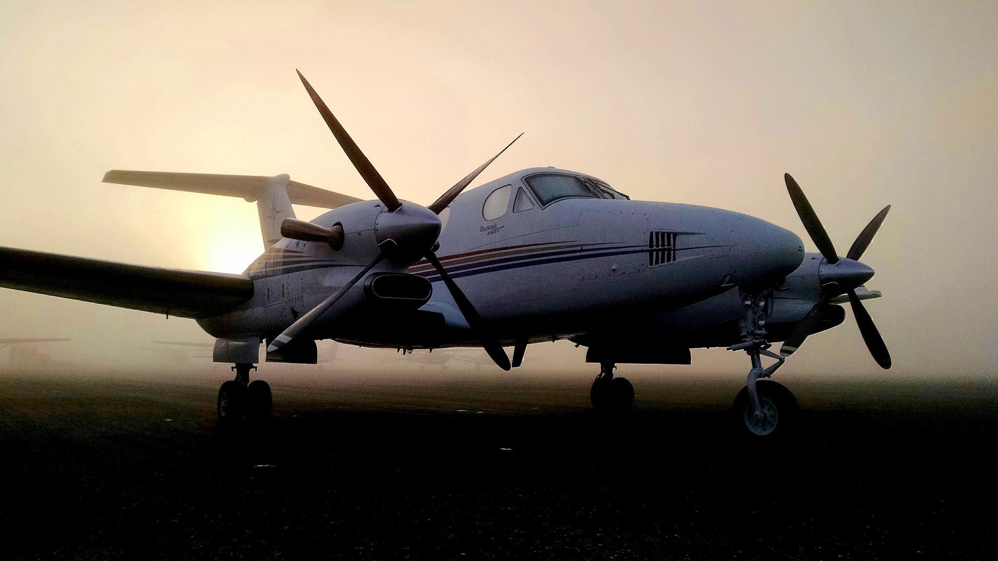 Beechcraft Super King Air 300 (N300MC) - After sunrise on a fog shrouded ramp in Sanford, Florida.