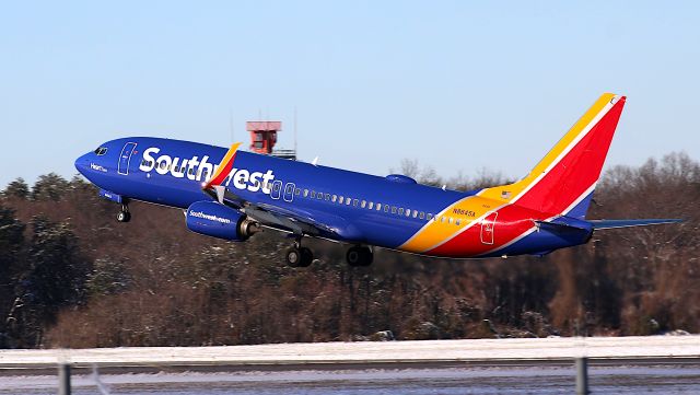 Boeing 737-800 (N8645A) - Southwest's "Heart Two" rotates off of a snowy runway 10/28.