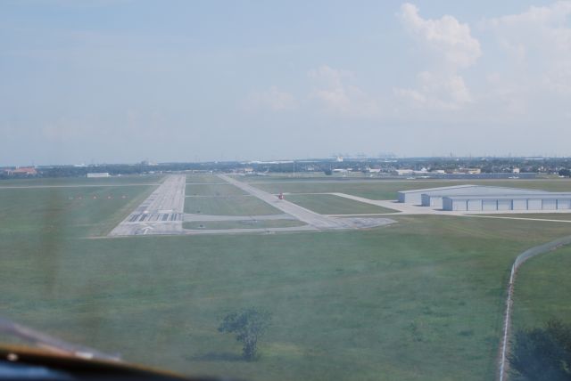 Piper Navajo (N94JM) - Final approach at La Porte, runway 12. There was a helicopter hovering on the taxiway as we landed.