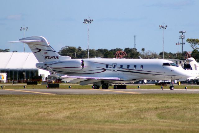 Bombardier Challenger 300 (N214RW) - Lining up to depart rwy 07 on 23-Oct-14.
