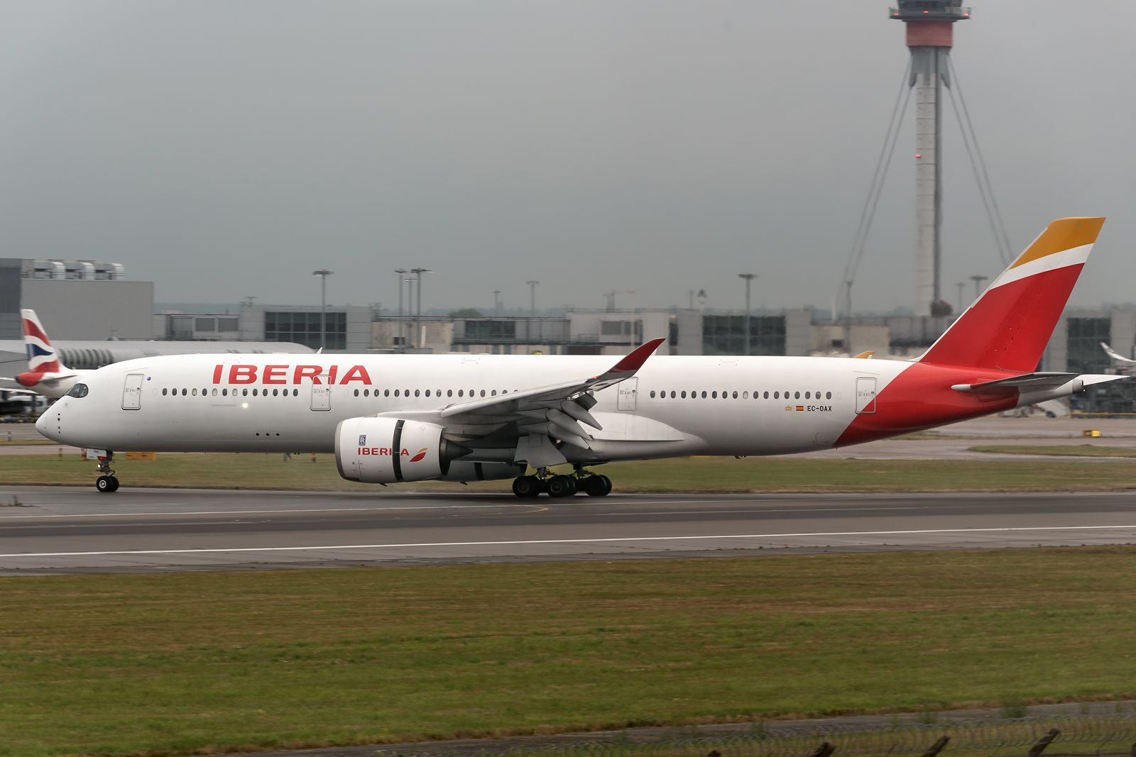Airbus A350-900 (EC-OAX) - 5th September, 2024:  The late arrival IB 3166 from Adolfo Suárez Madrid-Barajas exiting runway 09L at Heathrow - with her engine reverse thrust still activated due rain showers.