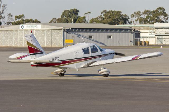Piper Cherokee (VH-PYZ) - Piper PA-28-235 Cherokee (VH-PYZ) taxiing at Wagga Wagga Airport.