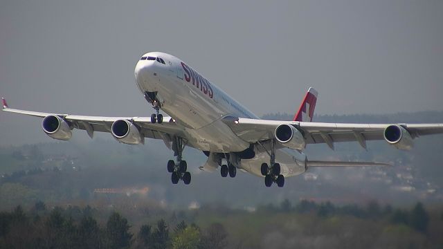 Airbus A340-300 (HB-JMI) - Departing for Shanghai....