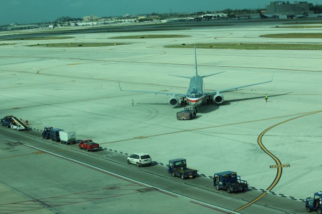 Boeing 737-800 — - 121013 AA B738 on pushback from Term D northside with some of the the traffic jam that it created.