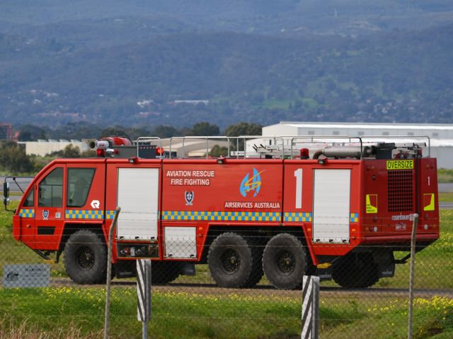 — — - Aviation Fire Rescue vehicle patrolling the perimeter fence at Adelaide International Airport.br /Thursday 12th July 2012.
