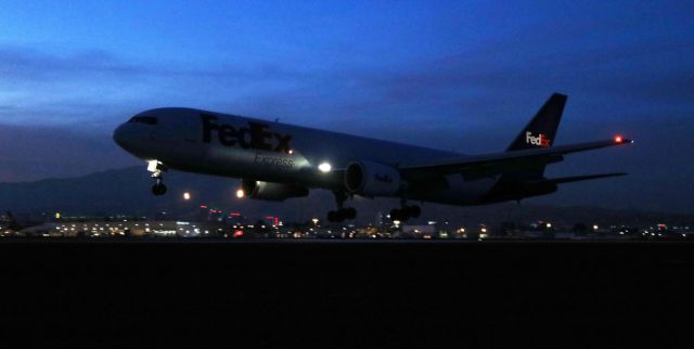 BOEING 767-300 — - The very last couple of minutes of dusk light in the west is backlighting a Fed Ex B763 as it arrives from Memphis.