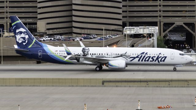 Boeing 737-900 (N280AK) - Crossing the bridge after landing on runway 26.