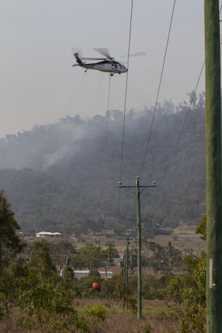 Sikorsky S-70 (N9FH) - Filling up to bomb the fire at Adelaide Park near Yeppoon.