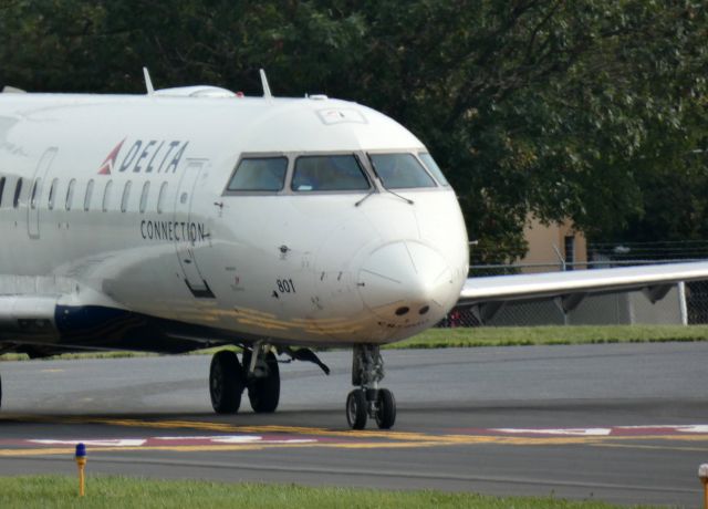 Canadair Regional Jet CRJ-200 (N801AY) - Taxiing for departure is this 2004 Delta Connection Canadair Regional Jet 200ER in the Autumn of 2021.