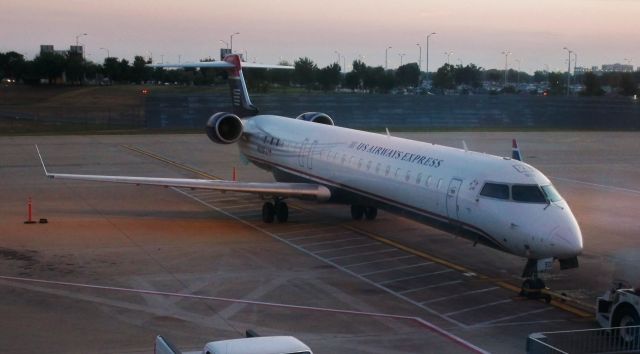 Canadair Regional Jet CRJ-900 (N913FJ) - US Airways Express (Mesa) CRJ-900ER N913FJ at AUS just as the sun is comming up on August 29, 2009.