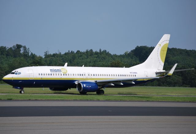 Boeing 737-800 (N734MA) - Miami Air charter for NASCAR teams taxiing to runway 20 at Concord Regional Airport, headed for the races in Indianapolis, IN / Concord, NC 7/28/11