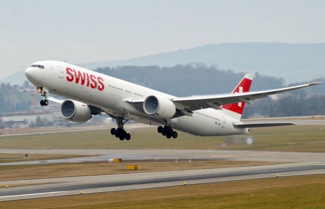 Boeing 777-200 (HB-JNF) - Swiss B777 taking off in rainny conditions.