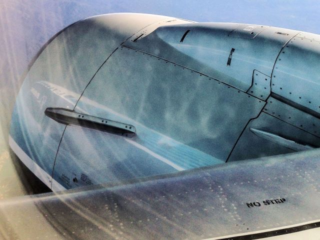 Boeing 737-800 (N512AS) - The fuselage of Alaskas Spirit of Seattle reflected onto the engine cowling during a flight from KSJC to KPDX on March 15, 2014.