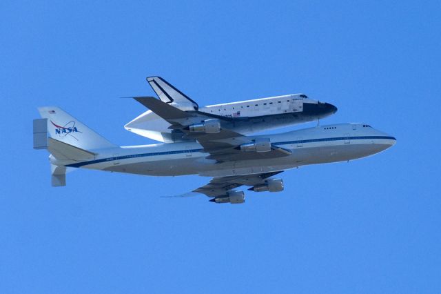 Boeing 747-200 (N911NA) - Shuttle carrier aircraft N911NA with Endeavour performs parade pass over the Johnson Space Center in Houston 12/11/2008.  The SCA/shuttle were en route from Edwards AFB, CA, to KSC in Florida, stopping at Bliss AAF and Carswell NAS before diverting through Houston on the way to Barksdale AFB, LA for an overnight stop.