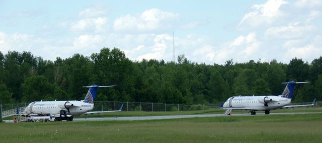 Canadair Regional Jet CRJ-200 (N983SW) - Catching some tarmac time is this 2005 United Express Canadair Regional Jet 200LR from the Spring of 2022. N652BR a similar CRJ is on the right.