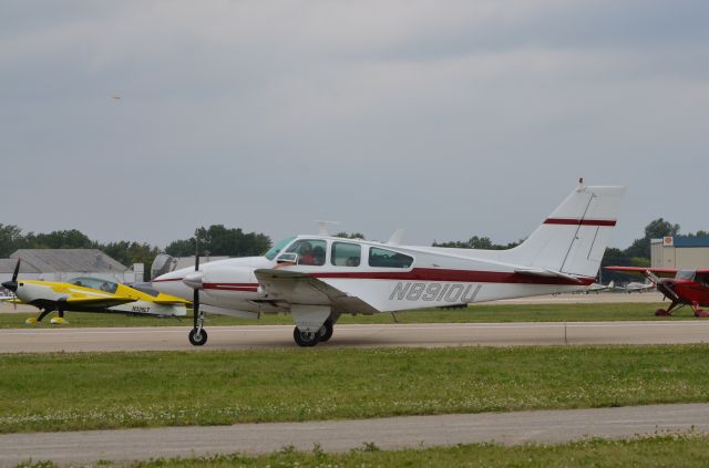 Beechcraft Bonanza (33) (N8910U) - Bonanza Mass Arrival at Oshkosh AirVenture 2014.