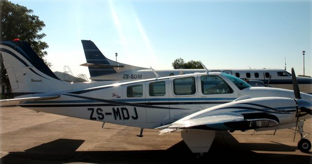 Beechcraft Baron (58) (ZS-MDJ) - Progress Airs Baron at Francistown.