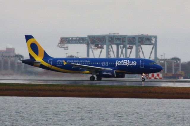 Airbus A320 (N775JB) - Jet Blue A320 in updated 'Vets in Blue' livery departing a rainy Logan Airport on 11/13.