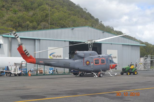 Bell VH-1 (P2-HCW) - Hevilift PNG, Bell 212 on contract to PNG Defence Force.br /Helicopter in Cairns, Queensland for maintenance.