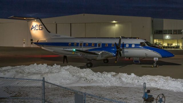 Embraer EMB-120 Brasilia (N128HL) - An Embraer EMB-120ER Brasilia parked under the lights at KVPZ.