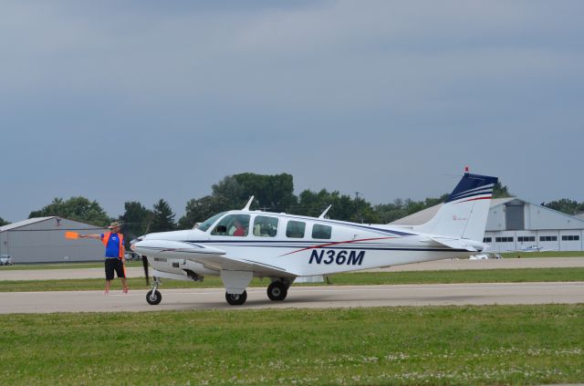 Beechcraft Bonanza (36) (N36M) - Bonanza mass arrival at AirVenture 2014