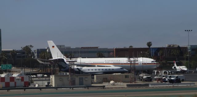 Airbus A340-300 (3EB1A6) - 6/19/18 the Konrad Adenaur, 10-+16 parked at LAX, next to Gulfstream 5 NIKE