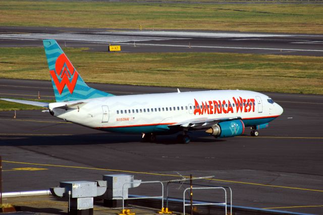 BOEING 737-300 (N157AW) - KPDX- 2/25/2005 photo of an America West Airlines 737-300 turning to the taxiway for a flight to KPHX.