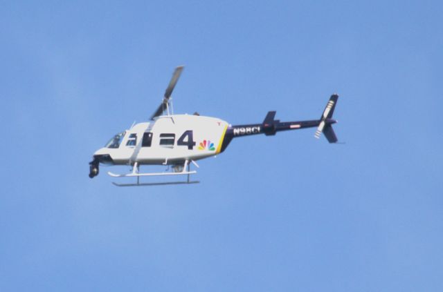 Bell JetRanger (N98CL) - Hovering over Herndon High School to provide video for NBC4 weather report.  The weatherman was an alumni of Herndon High School.