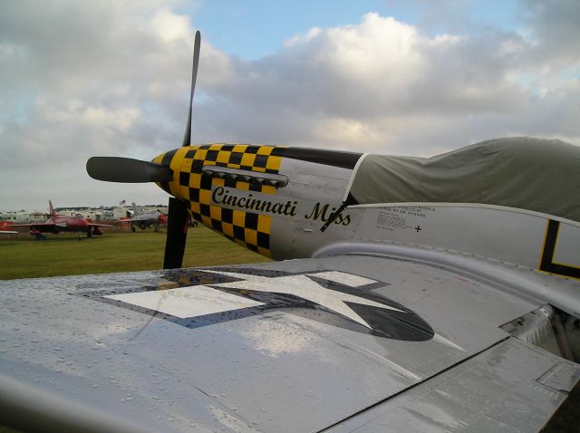 — — - Morning shower on Mustang at Oshkosh 2005.