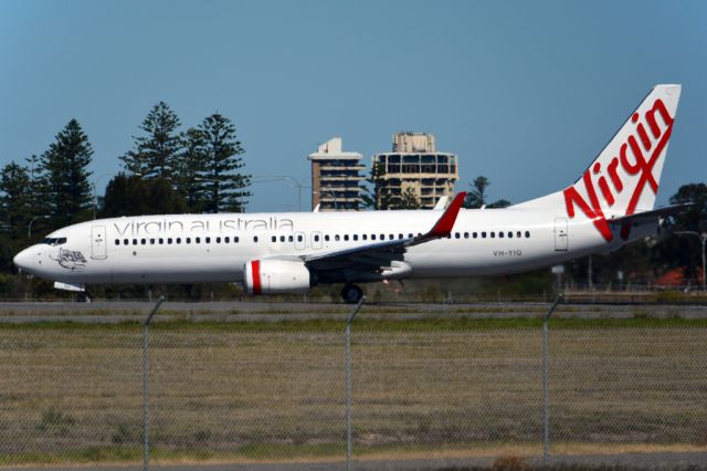 Boeing 737-800 (VH-YIQ) - Turning from taxiway on to runway 05, for take-off. Monday, 14th April, 2014.