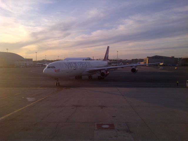 Airbus A340-300 (G-VELD) - The VS11 operated by G-VELD "African Queen" taxies into gate E8A at KBOS.