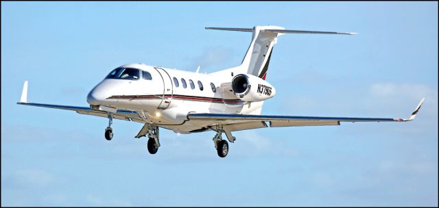 Embraer Phenom 300 (N379QS) - Short final at the Merced Regional Airport (KMCE)