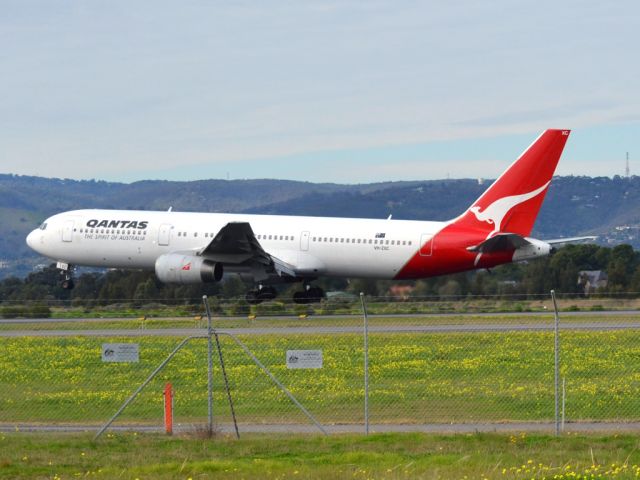 BOEING 767-300 (VH-ZXC) - About to put down on runway 05. Thursday 12th July 2012.