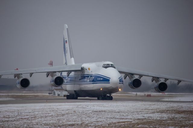 Antonov An-12 (RA-82046) - VDA5563 returning to the cargo pad after having a issue with its #3 engine.