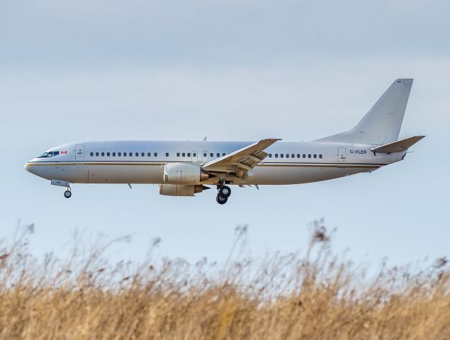 BOEING 737-400 (C-FLER) - Flair Airlines returning from Florida 2 hours late. Here on short finals for runway 24 at Hamilton (CYHM)