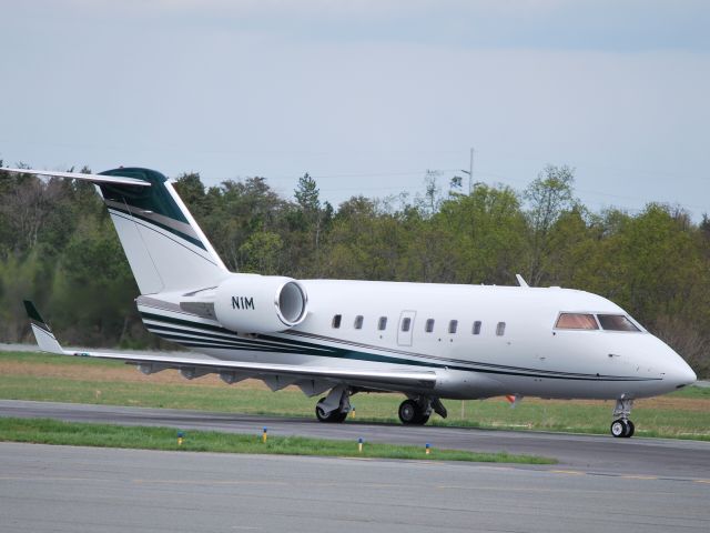 Canadair Challenger (N1M) - Taxiing to runway 02 KJQF - 4/7/09 (Update 12/17/10 - appears to now be registered as N42EE)