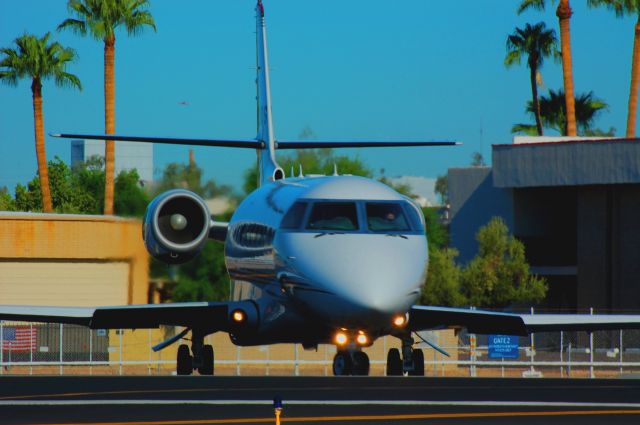 IAI Gulfstream G200 (N730QS) - Operating as ExecJet 730: position and hold, runway 3. Note, N613TV (helicopter TV3) in far distance over right horizontal stabilizer.