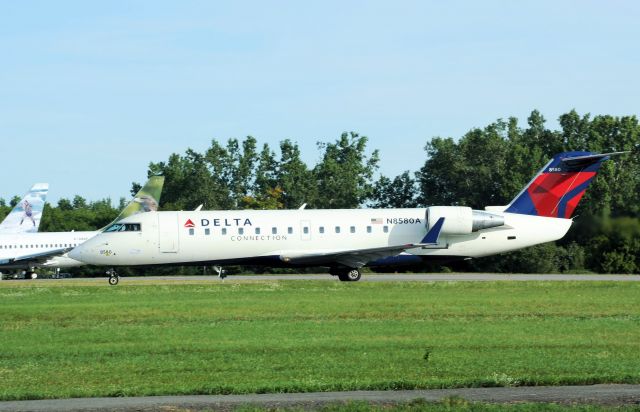 Canadair Regional Jet CRJ-200 (N8580A) - Departed on rwy 25 for Bishop Airport (KFNT), on 24-Aug-13.